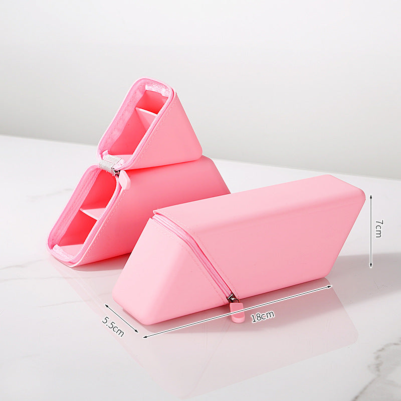 Pink wedge-shaped product on a white surface with measurements indicated.