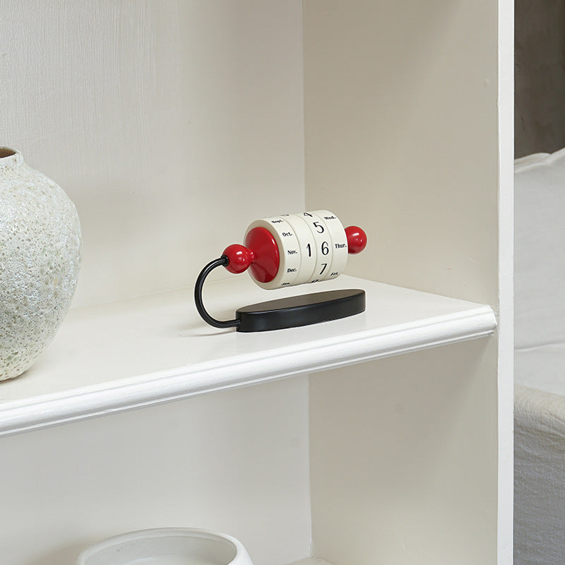 Perpetual calendar on a white surface with a neutral background