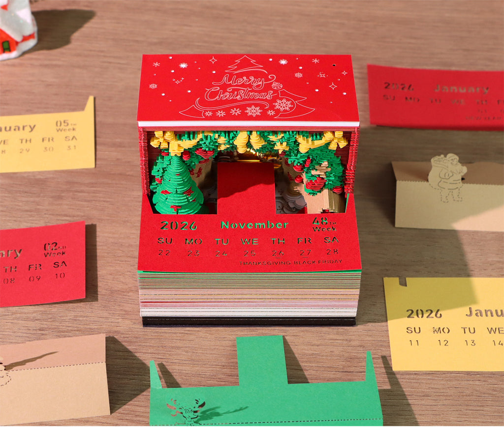 Red Christmas-themed calendar with cut-out design on a wooden surface