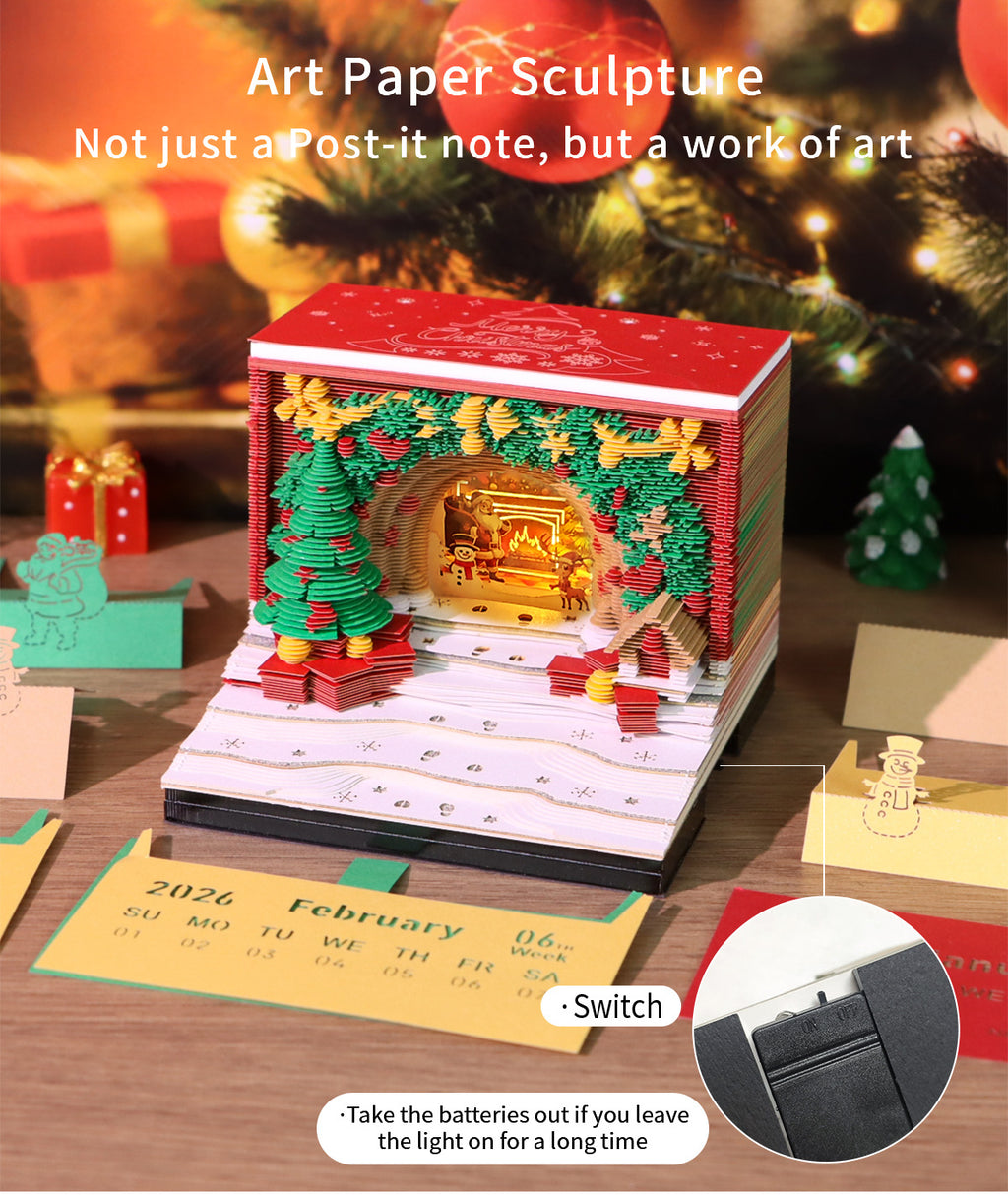 3D paper sculpture with Christmas theme on a table with a calendar, surrounded by festive decorations.